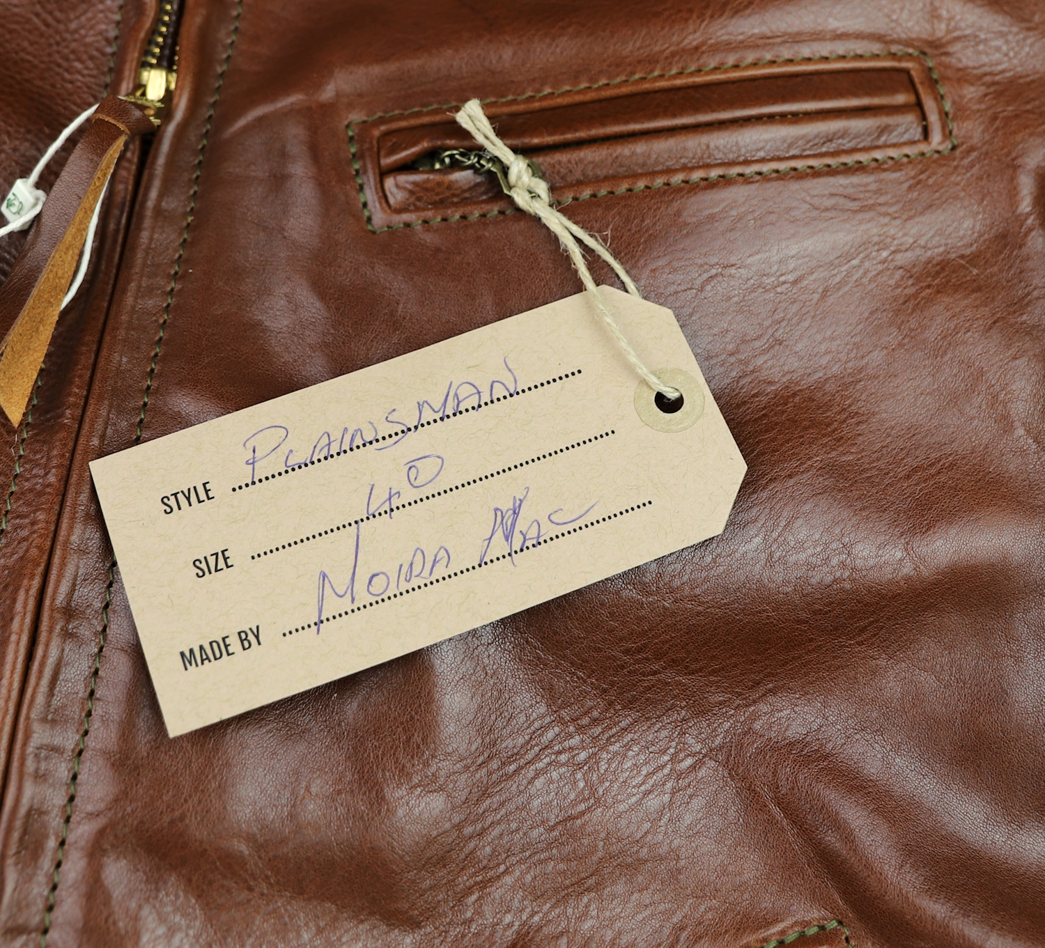 Aero Plainsman Russet Badalassi Cowhide name tag.jpg