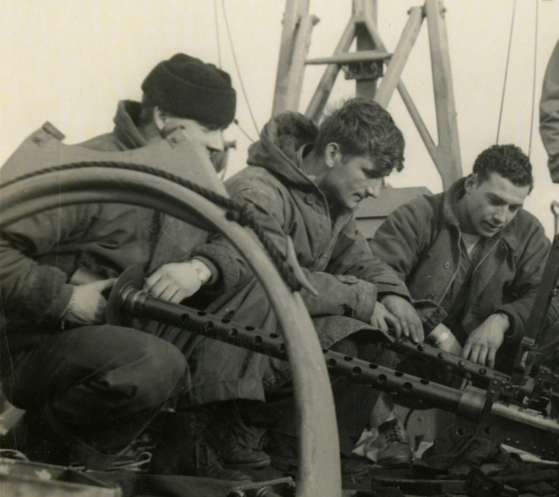 US PT Boat Crewmen maintenance on machine guns cut.jpg